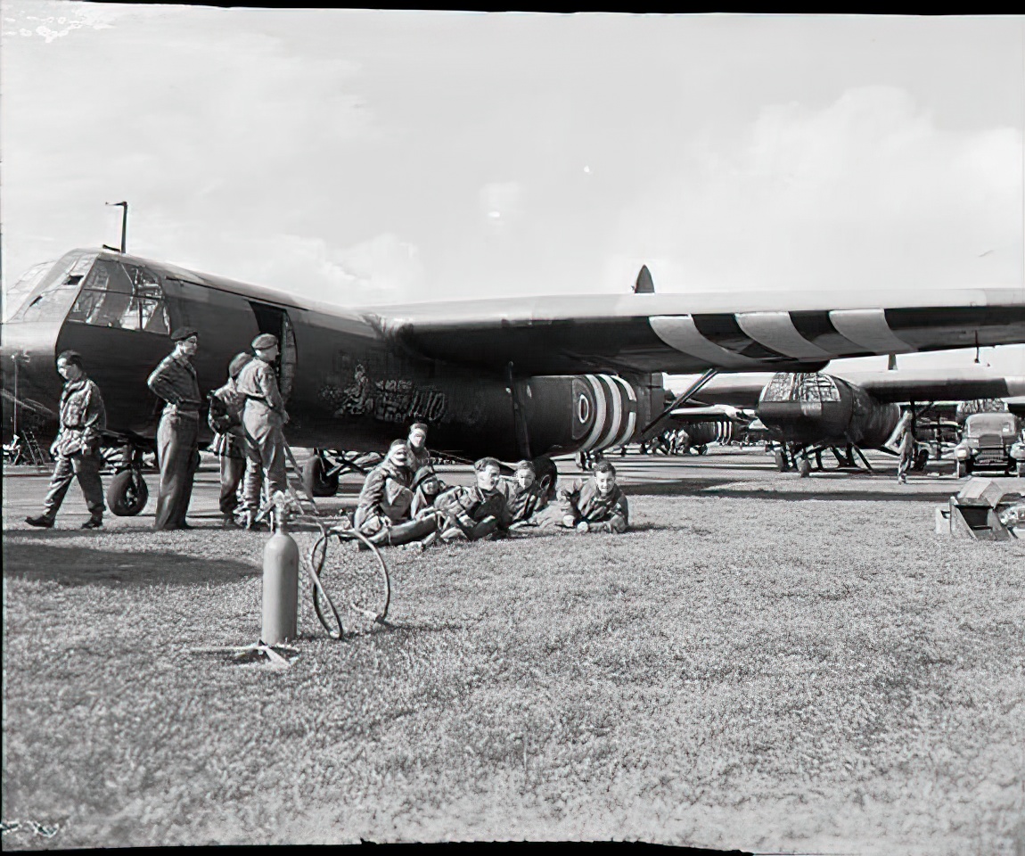 scene at RAF Harwell, Oxfordshire, just before the start of the Airborne invasion of Holland. British airborne troops wait to emplane by their Horsa glider