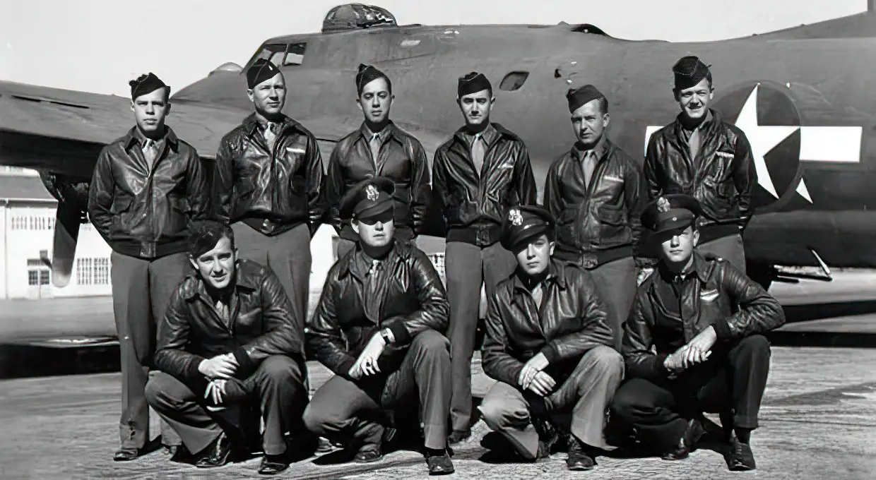 The crew of 379th Bomb Group's "Ye Olde Pub" (42-3167). Left to right standing: S/Sgt. Bertrand "Frenchy" Coulombe, Sgt. Alex Yelesanko, T/Sgt. Richard Pechout, S/Sgt. Lloyd Jennings, T/Sgt. John "Hugh" Eckenrode, and S/Sgt. Sam Blackford. Left to right kneeling: 2nd Lt. Charles "Charlie" Brown, 2nd Lt. Spencer "Pinky" Luke, 2nd Lt. Al Sadok, and 2nd Lt. Robert Andrews